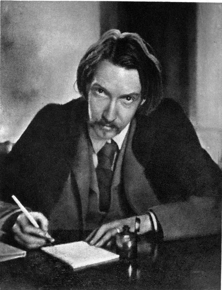 Robert Louis Stevenson at his writing desk, photogravure frontispiece of his Letters, 1899